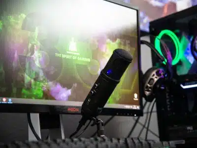 black microphone beside black flat screen computer monitor